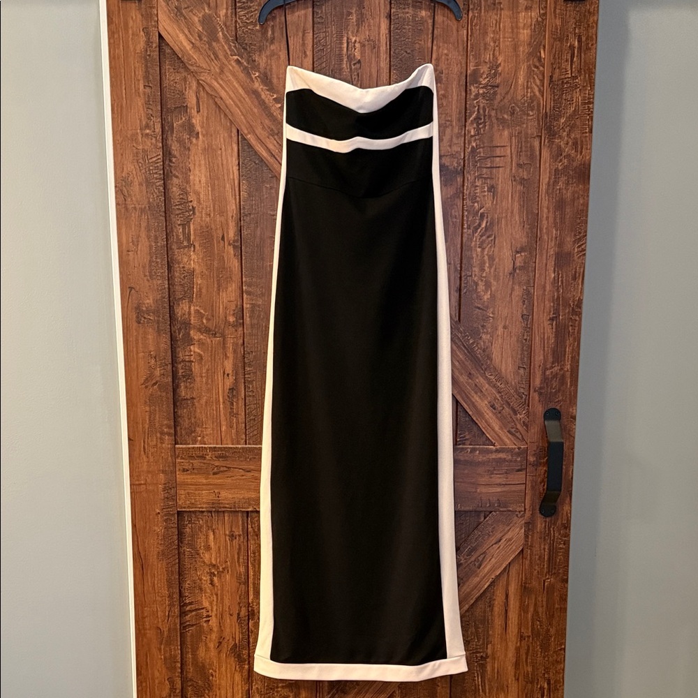 Elegant Black and tan Strapless Dress size medium. Stretchy gets holds shape.